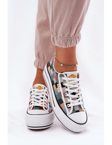 Raštuoti moteriški sportbačiai ant platformos